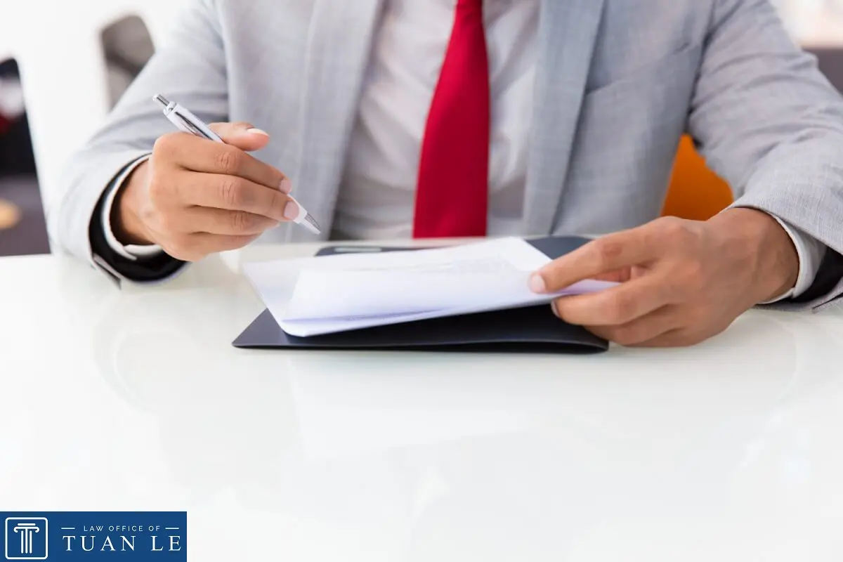 A man signing a paper