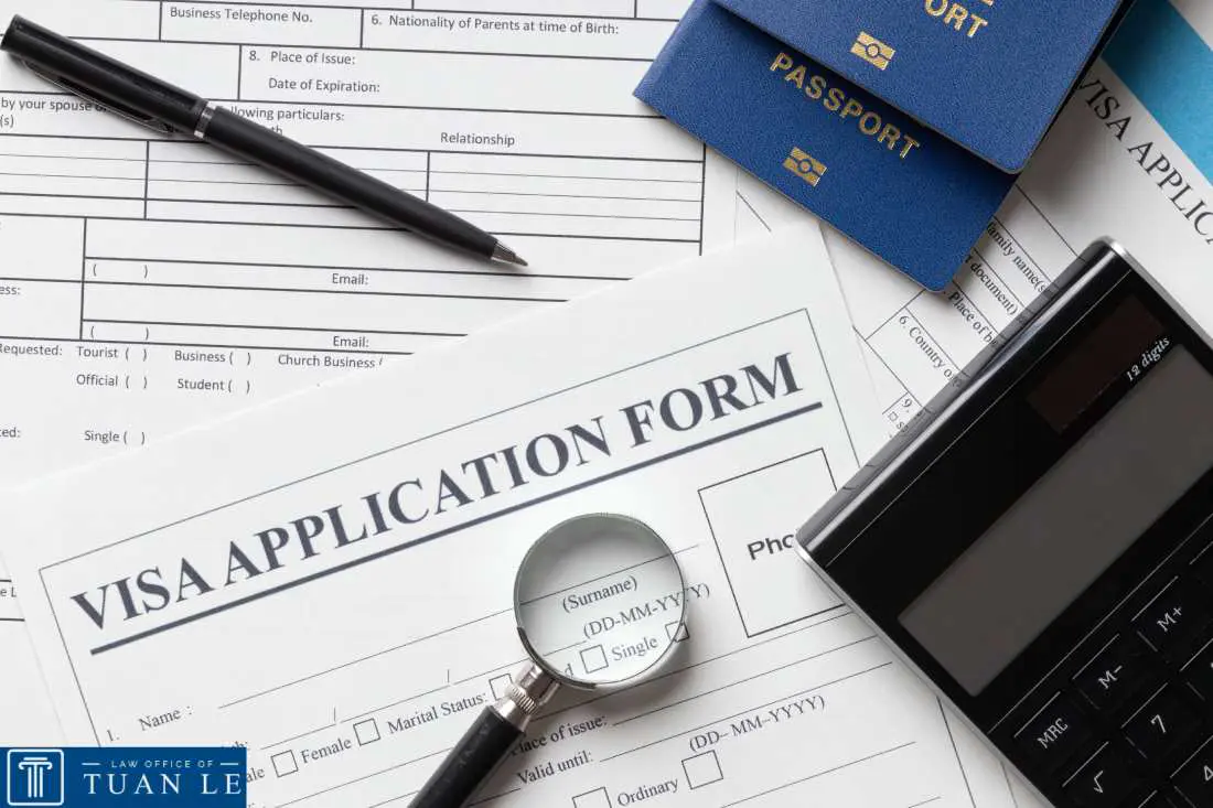 Top view of organized visa application documents and forms